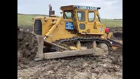 Caterpillar D9H in action push loading a fleet of 621 and 637 scrapers.#short #video