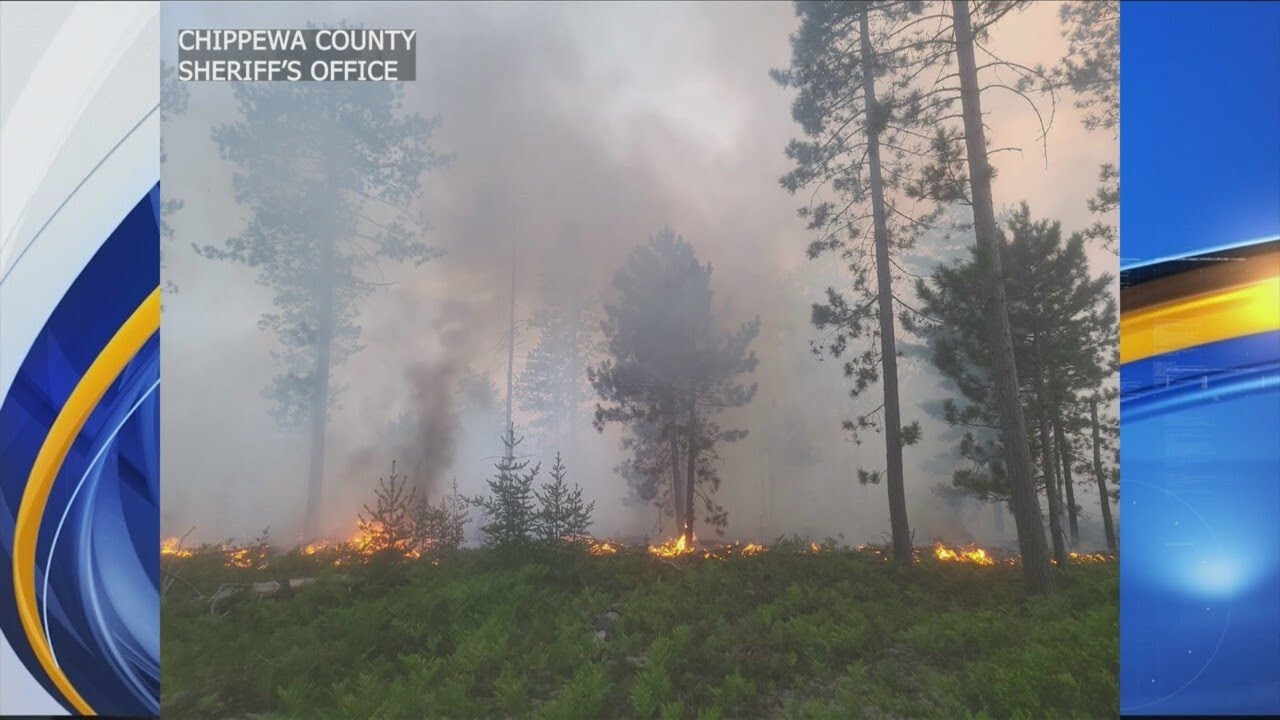 Crews battle forest fire in Whitefish Township - YouTube