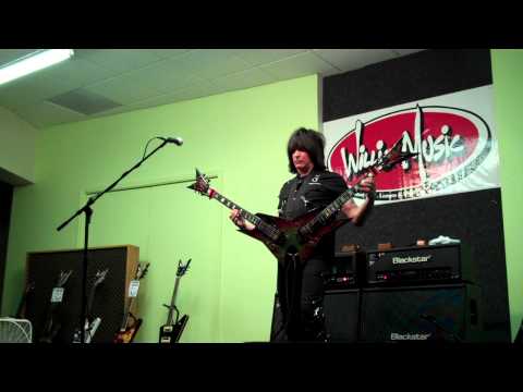 Michael Angelo Batio performs on his double-necked...