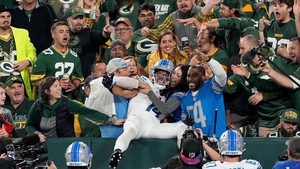 Lions' Amon-Ra St Brown met with beer shower upon Lambeau Leap