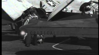 Pilot talks with his gunner on flight of a carrier of Task Force 38 3 underway d