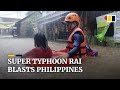 Super Typhoon Rai slams through the Philippines forcing tens of thousands to evacuate