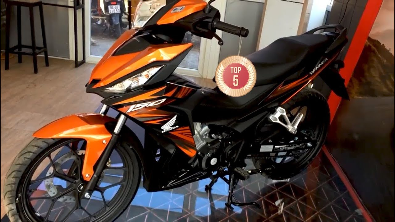 Winner X đen cam nguyên bản lên tem Repsol