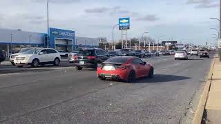 This Scion FRS has a set of custom wheels, 5 inch exhaust tips and a carbon fiber spoiler.