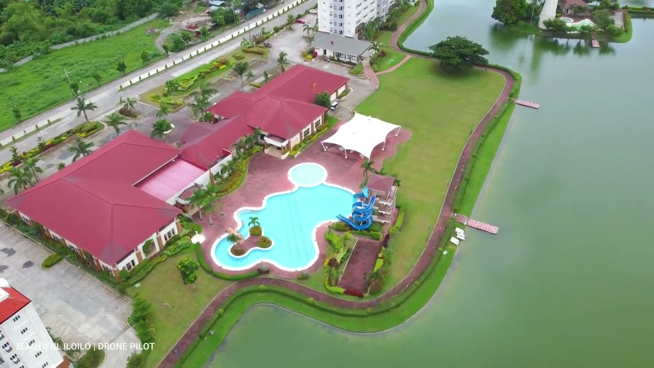 THE SUBDIVISION WITH HOTELS, A LAKE AND A LIGHTHOUSE GREEN MEADOWS