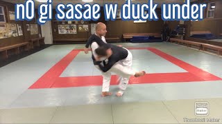 Duck under with “Sasae tsurikomi Ashi” and take him right to his back !
