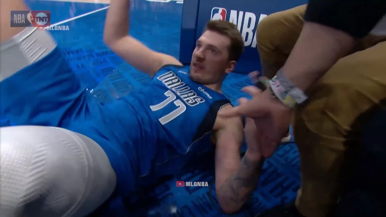 Luka Doncic took a hard fall and just sat down on the bench grabbing at his right shoulder