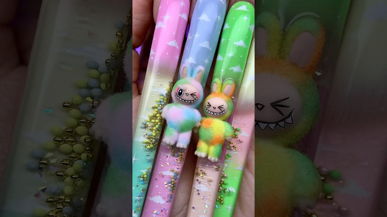 I sculpted fluffy Labubu charms and sealed them inside pastel aqua nails!