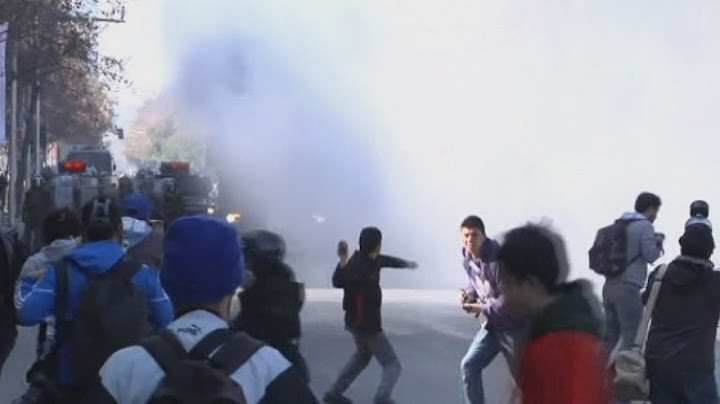 Police fire tear gas and water cannon to disperse protestors in Chile