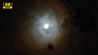 Moon in Night Sky. Moon in the clouds. 4K video 2 min 40s