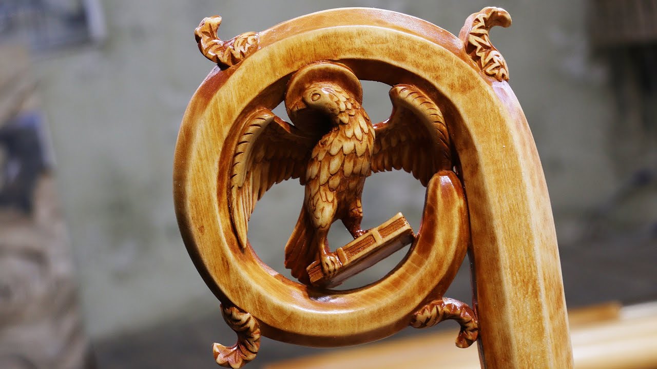 Staff with an eagle on the book. Linden wood. Wood carving