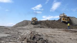 OM NOM NOM - Caterpillar 657 Scrapers Raping a Mountain Part 1