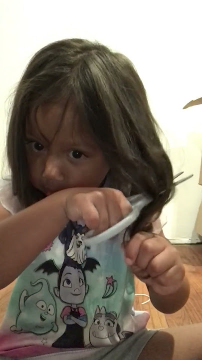 Adorable five year old caught cutting her own hair