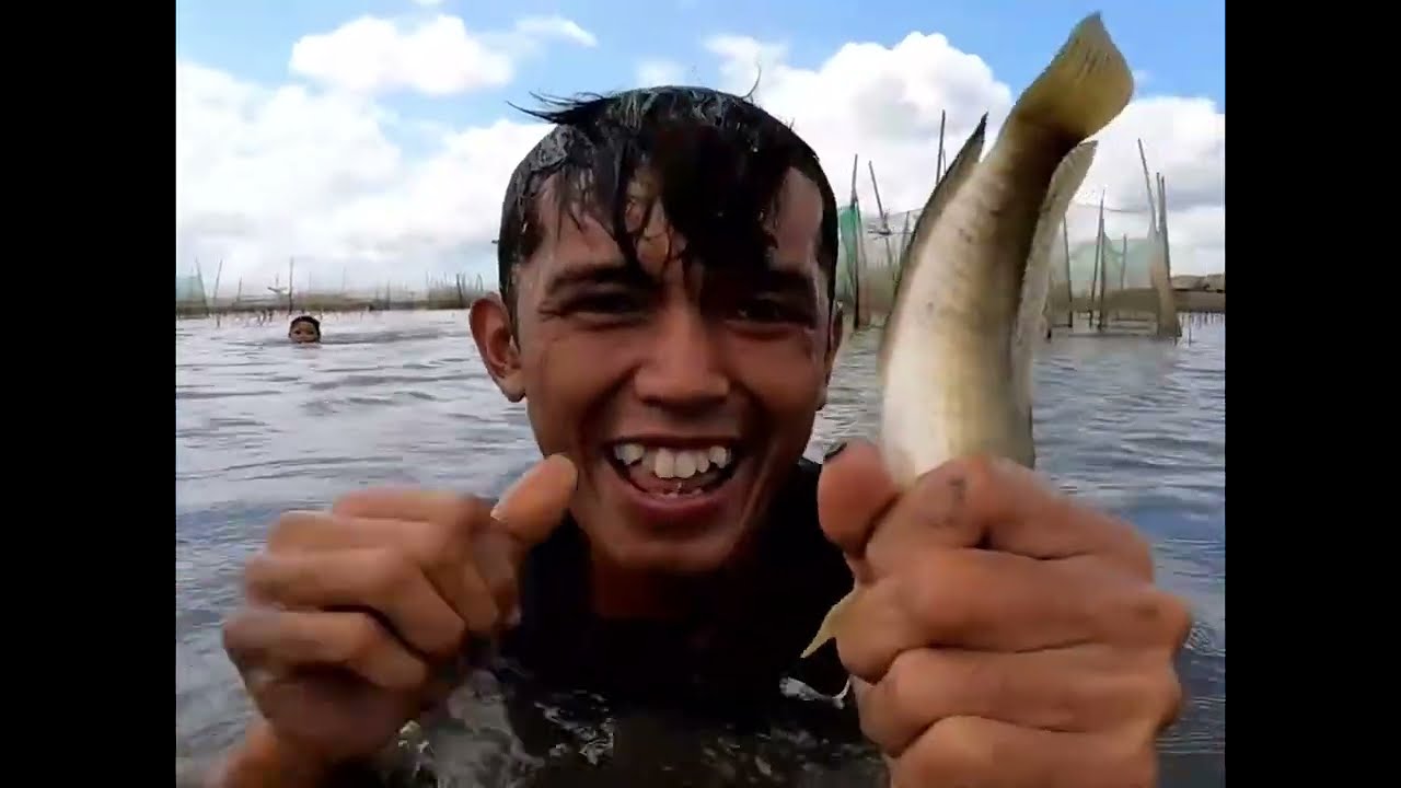 A Day of Survival: Catching Fish in a Deep Water Canal