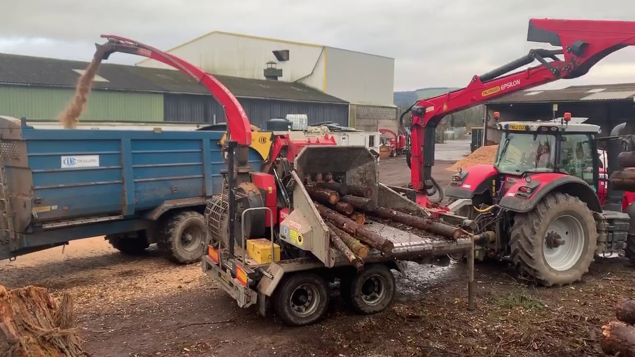 Log chipping into biomass fuel - YouTube