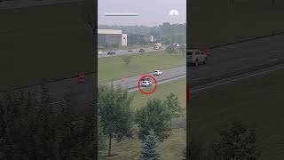 Traffic camera captures shoplifting suspect clinging to moving car during police chase | NBC4