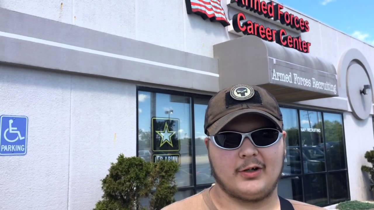 Genesee County miltia group members protect Flint Township recruiting center