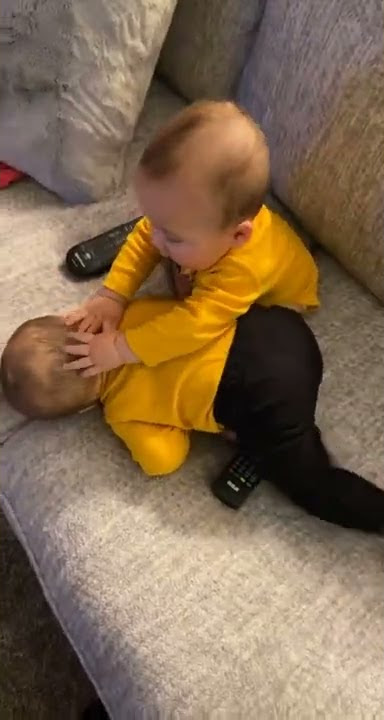 Twins babies fighting scene