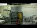 Cleaning and sanitizing of an industrial meat processing machine