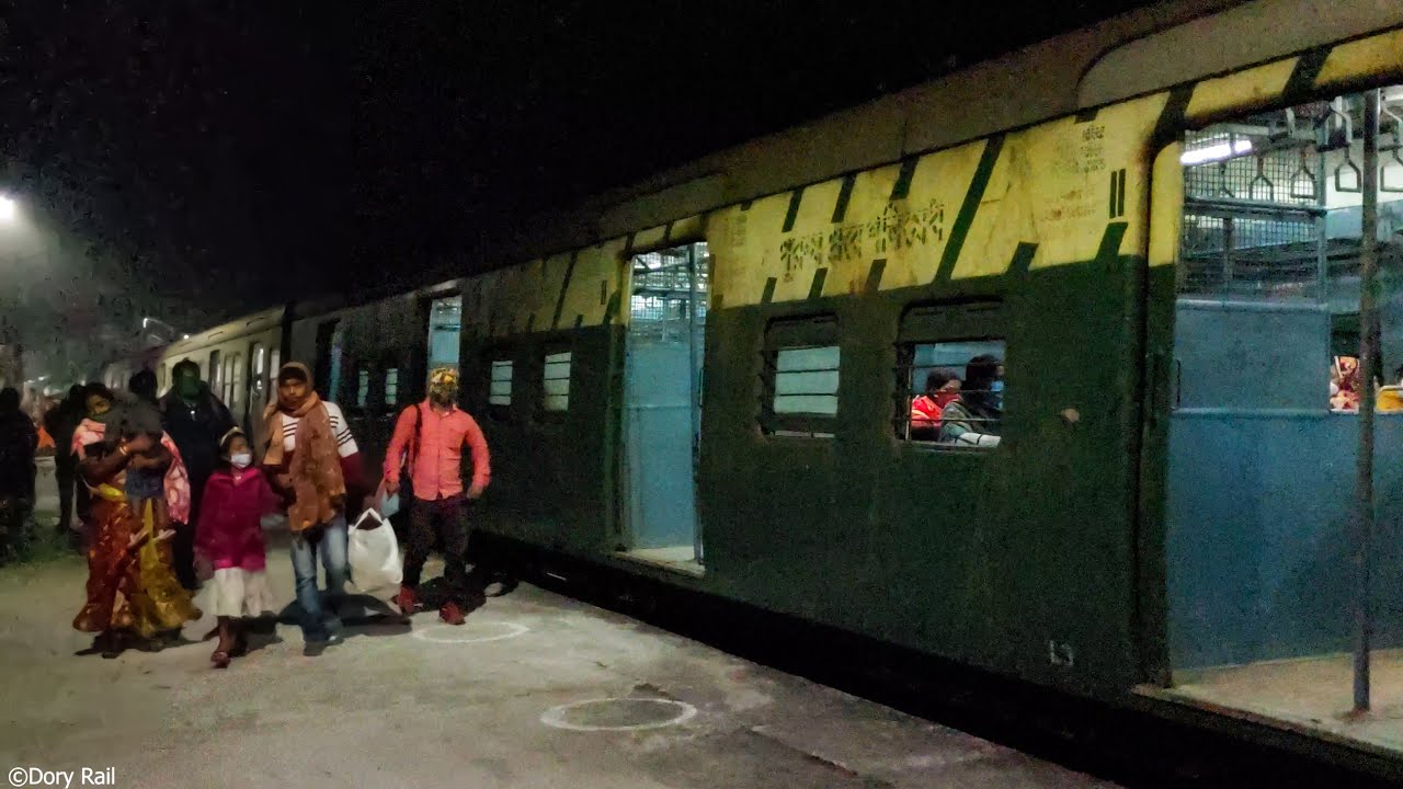 Old EMU local train at night popped up from pitch darkness to colorful light World | Eastern Railway