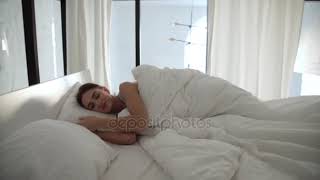 depositphotos 208744416 stock video sleep woman sleeping in bed