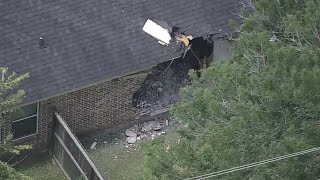 Raw video: Metro bus crashes into home near Hobby Airport
