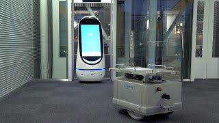 建物エレベータとサービスロボットの統合制御技術を開発