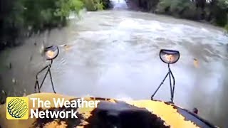 School bus swept away after driver tries to cross high water with child on board (on cam)
