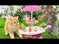 Naughty BiBi makes ice cream for Ody cat