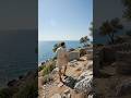 Young man walking coast Adriatic