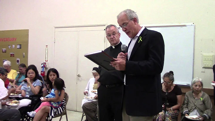 Fr. Jeffrey Keyes receiving a commendation from th...