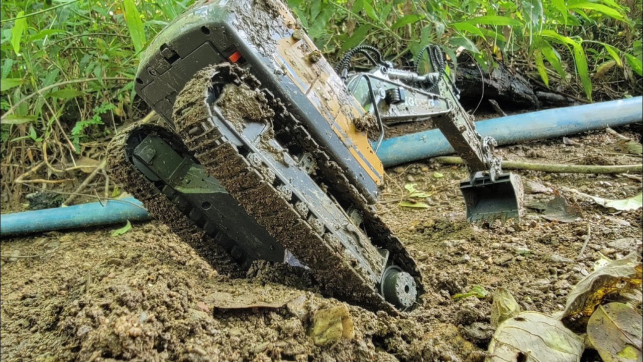 Construction machinery is excavating sand for construction work.