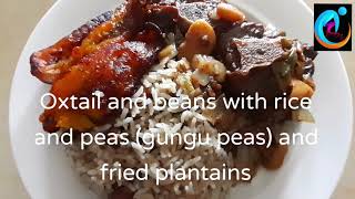 Oxtail and beans with rice and peas and fried plantains