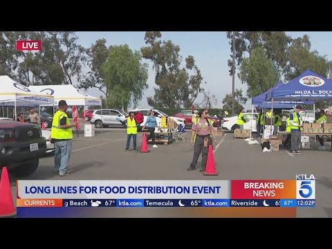 Lines build at food distribution site as historic government shutdown continues