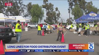 Lines build at food distribution site as historic government shutdown continues