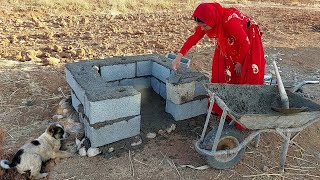 Building a small house for a dog: Maryam's art in the mountains.