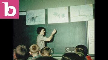 1950s - Teacher writes on chalkboard