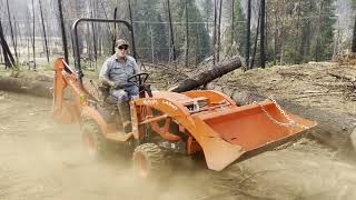 Can A KUBOTA BX23S Skid Logs