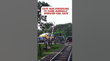 Gate man struggling to close a manually operated Railgate