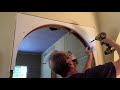 Installing a curved arch in a standard doorway.