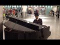 Amazing pianist plays Disney Little Mermaid at Heathrow airport