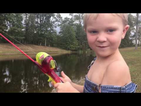 Little boy fishing with lightning mcqueen, cars fishing pole. 