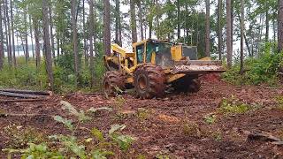 To Muddy to work. Tigercat 620E skidder and 742G cut down machine returning to the deck.