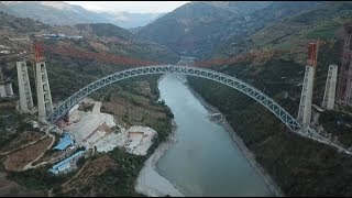 Steel Truss Arch of Four-lane Railway Bridge Linked up in China
