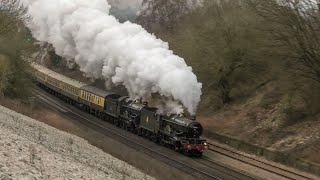 GWR 5043 & 7029 Thunder Over Hatton Bank At 62mph !
The return run of the double headed Great Western Castles would see the pair obliterate the 3 mile Climb of Hatton Bank. The climb starts just after Warwick station and heads up to Hatton Station. What we were treated to was nothing over than spectacular with the Great Western duo taking the bank in a barnstorming fashion with a 62mph passage over top, while the load was a light one, with just five coaches per engine to haul, the pair were signal checked near Warwick Parkway, so they could of gone quicker. The gradient From Warwick Station is not steep, though its a good pull and at a gradient of 1/108, 1/103 and 1/110 it will always make a locomotive sing !
This topped off a memorable day with Tyseleys deadly duo and it was great to witness the unusual sight of two Great Western Castles on the mainline. With two operational Castles now available attentions will turn to other double headed runs with the Welsh Marches next up in May and maybe the Devon Banks which could end the exodus of Great Western steam in Devon & Corwall.
I hope you enjoy the video.
A big thanks to Black Country Steam Videos for assisting us with our equipment at Hatton Junction GWR 5043 & 7029 Thunder Over Hatton Bank At 62mph !