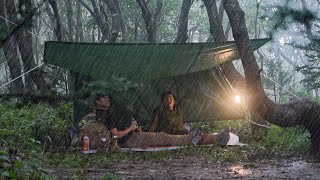 Camping in heavy rain without tents in the mountains