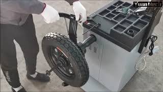 Wheel balancer motorcycle adapter installation and operation