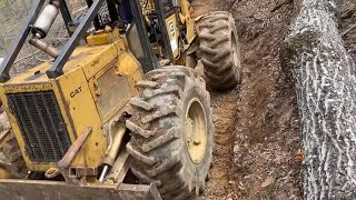 Caterpillar 518 Skidder with some heavy skids