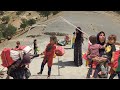 Nomadic family of twins returns home after hard days of harvesting