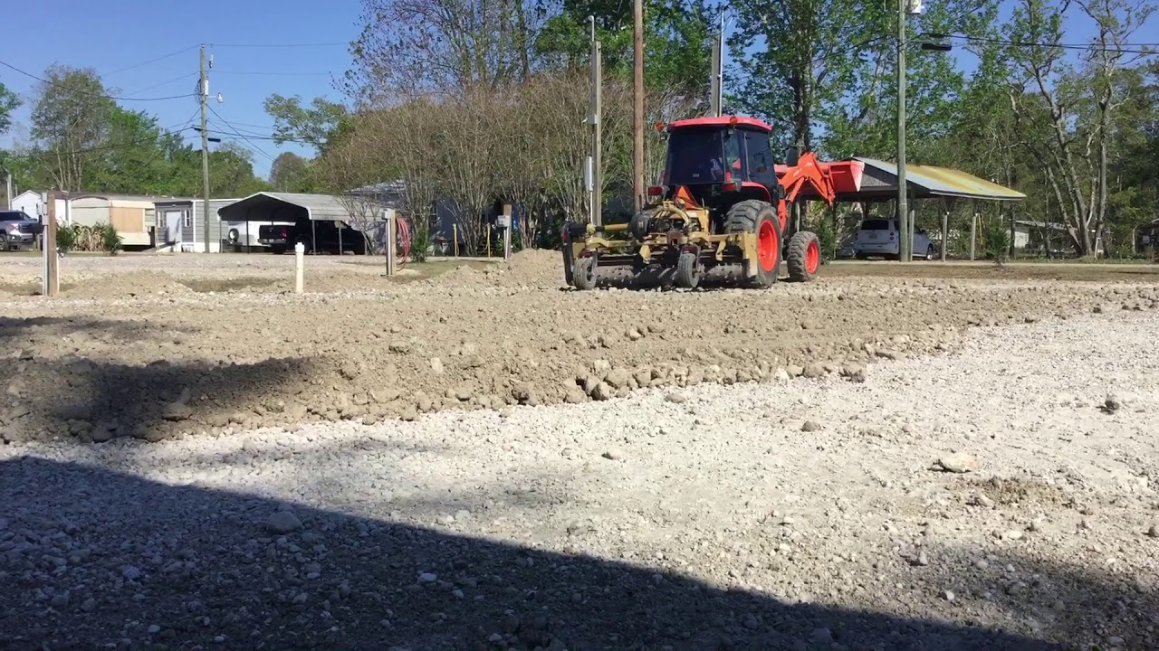 L5740 Kubota with a Land Pride 1690 power rake - YouTube